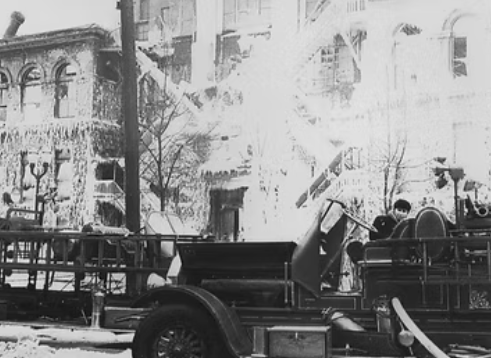 A black and white photo of a fire engineAI-generated content may be incorrect.